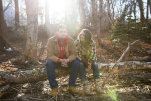 Tucker Lane and his mother, Lynn Cash, sit in the wooded backyard of his home in West Barnstable, Mass. Kayana Szymczak for NPR